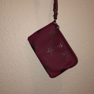 magenta coach wristlet! star print